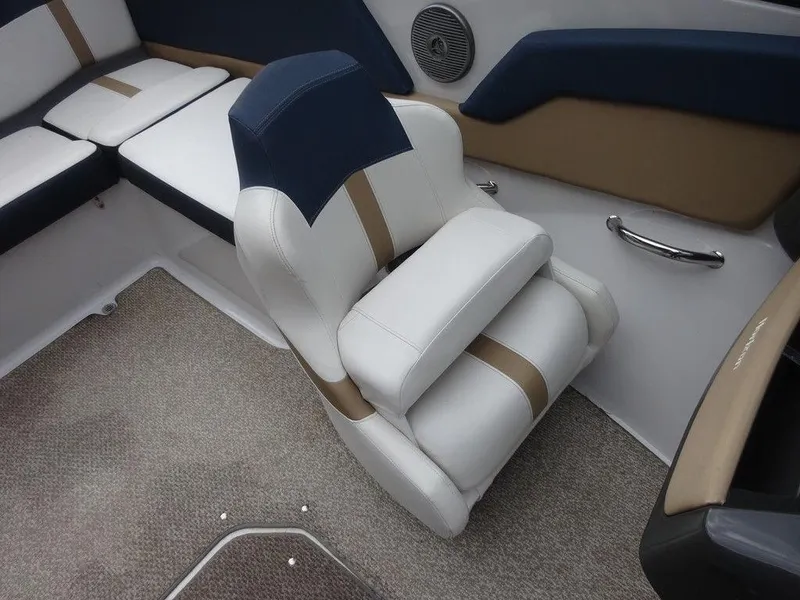 Slide: The Image of 2013 Four Winns Horizon 200 boat interior with cushioned seating and carpeted flooring. - 10