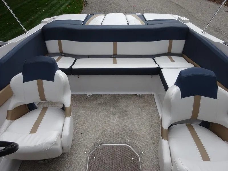 Slide: The Image of 2013 Four Winns Horizon 200 boat interior with white and blue seating. - 16