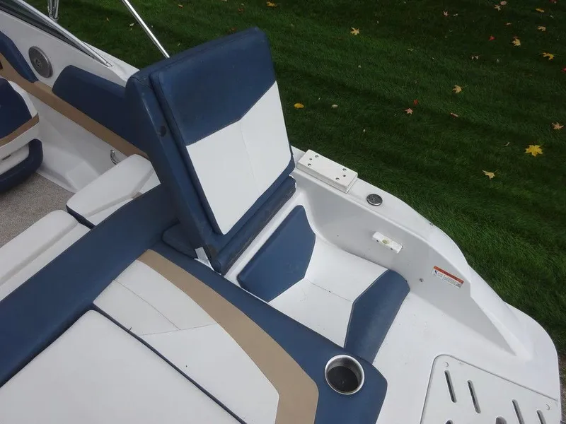 Slide: The Image of 2013 Four Winns Horizon 200 boat interior with blue and white seating. - 19