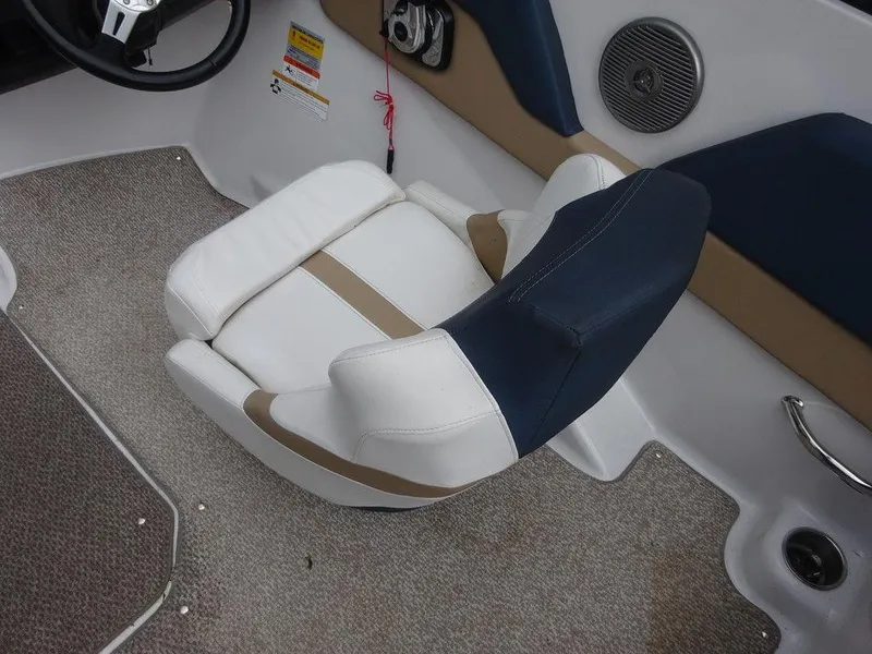 Slide: The Image of 2013 Four Winns Horizon 200 boat interior with cushioned seating and carpeted flooring. - 4