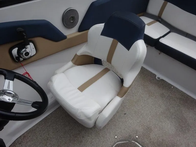 Slide: The Image of 2013 Four Winns Horizon 200 boat interior with white and tan seating. - 6