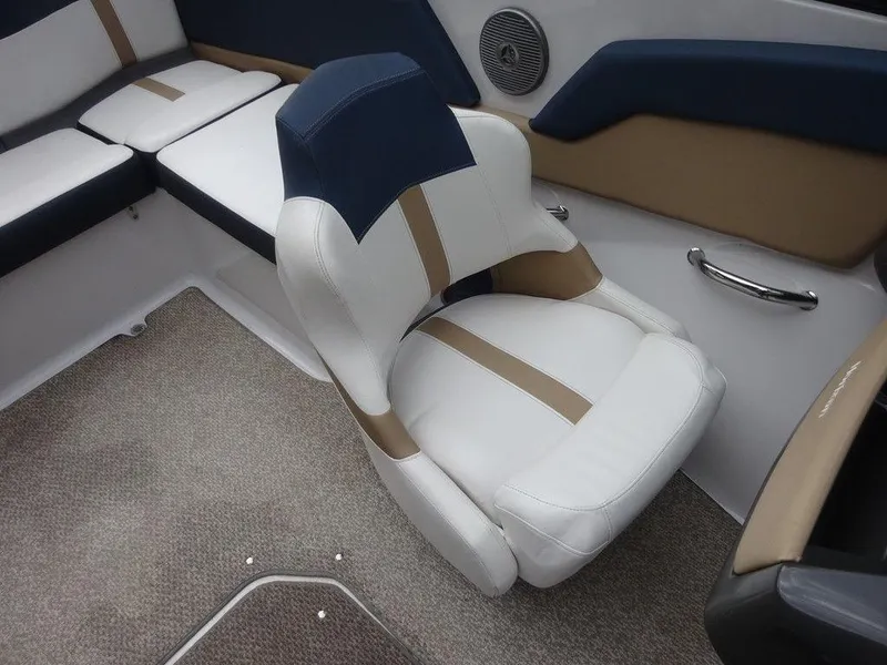 Slide: The Image of 2013 Four Winns Horizon 200 boat interior with cushioned seating and carpeted floor. - 9