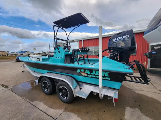 Slide: The Image of 2024 Majek Boats 21 RFL on trailer, featuring Suzuki outboard motor. - 4