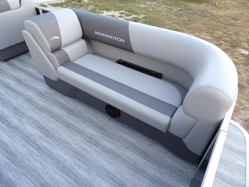 Slide: The Image of 2025 Bennington 21 SL boat seating with gray upholstery and logo. - 10