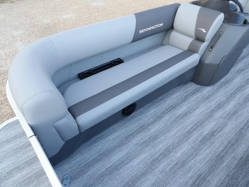 Slide: The Image of 2025 Bennington 21 SL boat interior with gray seating and sleek design. - 11