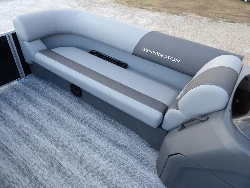 Slide: The Image of 2025 Bennington 21 SL pontoon boat interior with gray seating and carpet. - 12