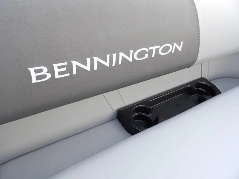 Slide: The Image of 2025 Bennington 21 SL boat seat with cup holders, featuring sleek design. - 16