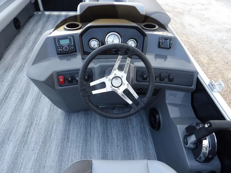 Slide: The Image of 2025 Bennington 21 SL boat dashboard with steering wheel and control panel. - 20