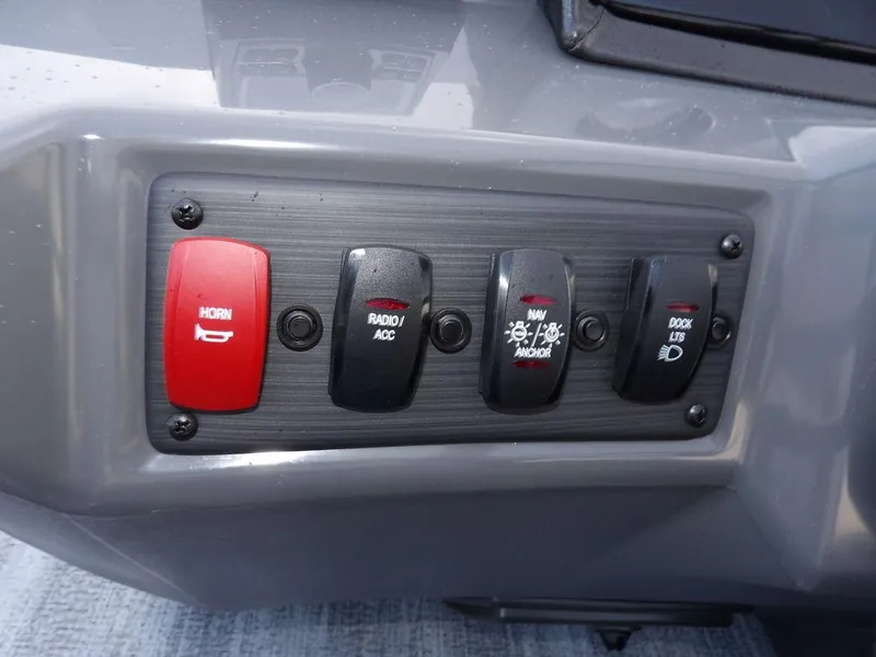 Slide: The Image of Control panel of 2025 Bennington 21 SL boat with labeled switches. - 21