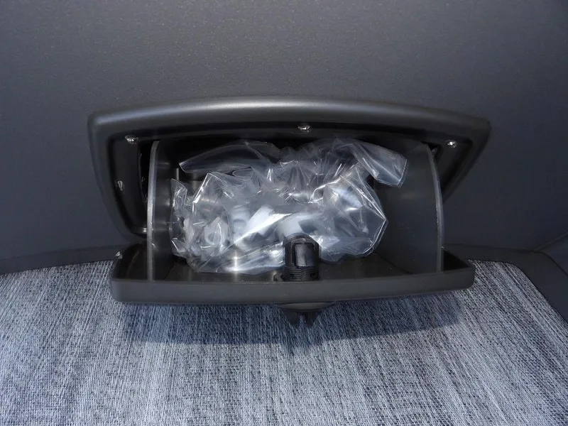 Slide: The Image of Storage compartment in 2025 Bennington 21 SL boat, containing plastic packaging. - 27