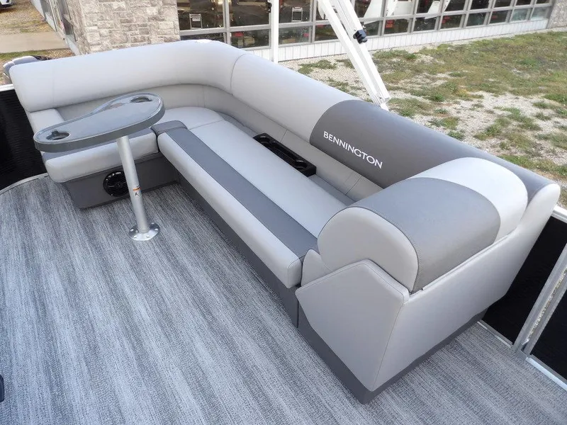 Slide: The Image of 2025 Bennington 21 SL pontoon boat with gray seating and table. - 29