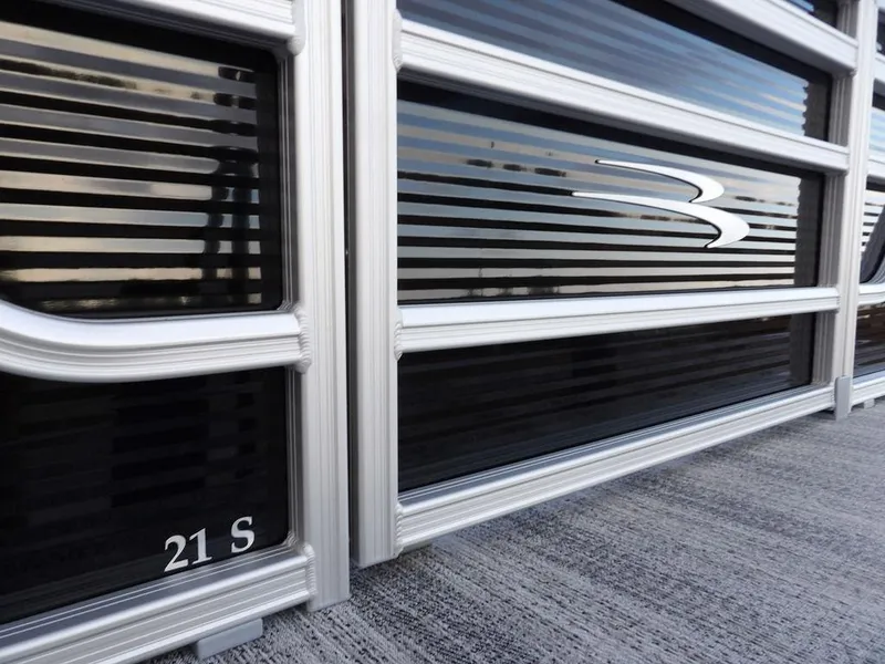 Slide: The Image of Close-up of 2025 Bennington 21 SL boat exterior with sleek design and logo. - 35