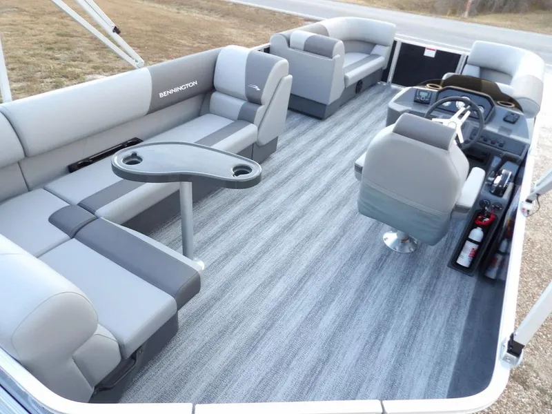 Slide: The Image of 2025 Bennington 21 SL pontoon boat interior with gray seating and modern helm. - 36