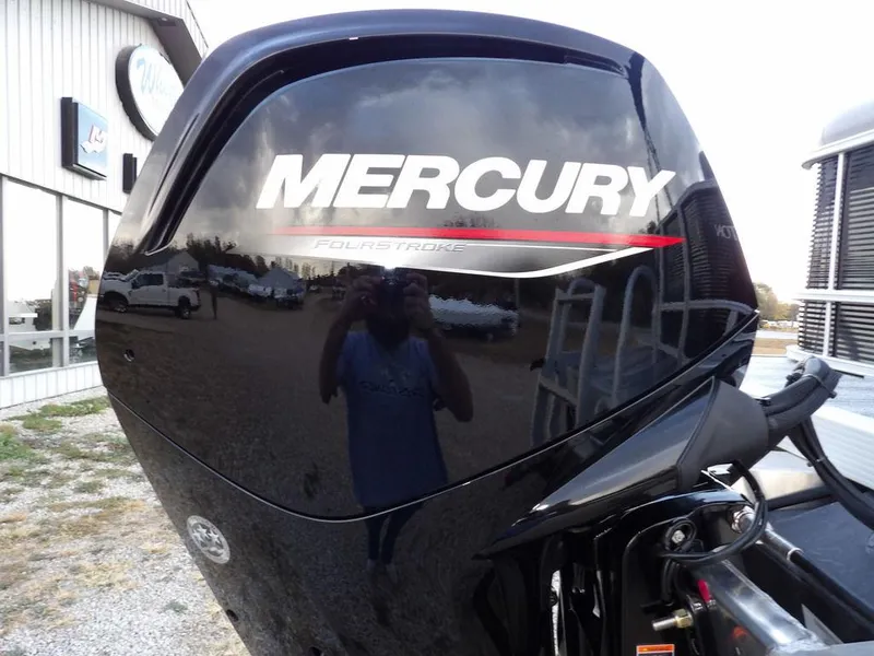 Slide: The Image of Mercury outboard motor on 2025 Bennington 21 SL boat, reflecting surroundings. - 47