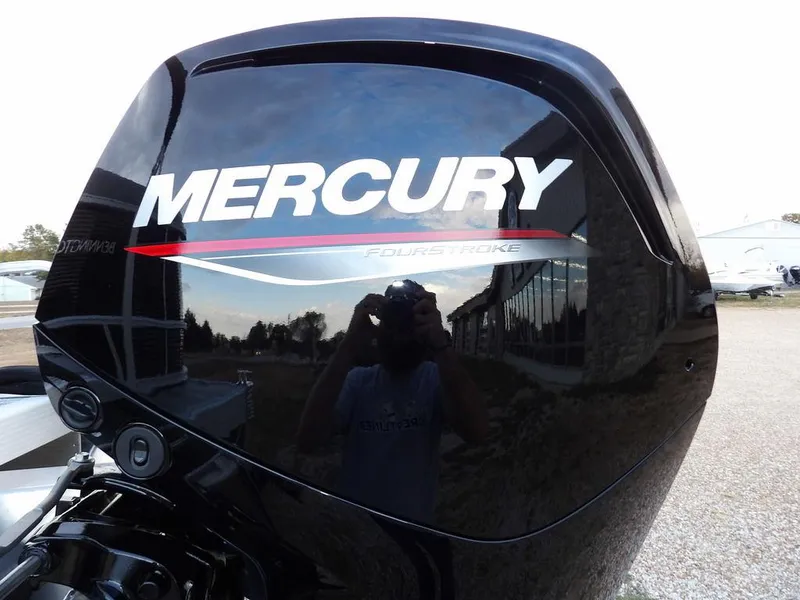 Slide: The Image of Mercury FourStroke engine on 2025 Bennington 21 SL boat, reflecting surroundings. - 49
