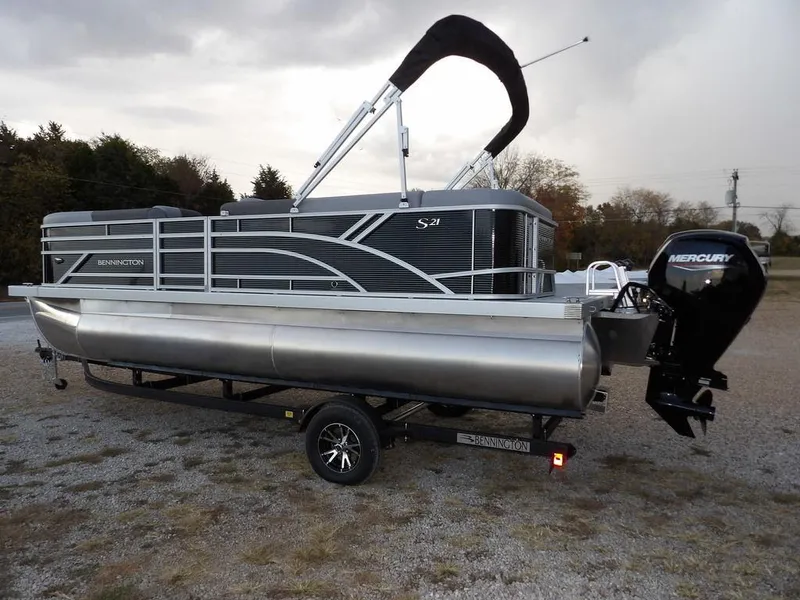 Slide: The Image of 2025 Bennington 21 SL pontoon boat with Mercury engine on trailer. - 5