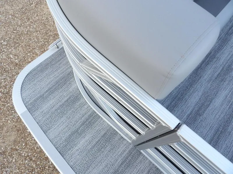 Slide: The Image of 2025 Bennington 21 SL pontoon boat with sleek silver railing and gray flooring. - 8
