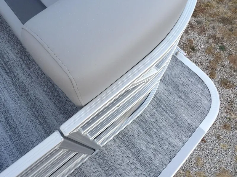 Slide: The Image of 2025 Bennington 21 SL pontoon boat, featuring sleek silver railing and gray flooring. - 9