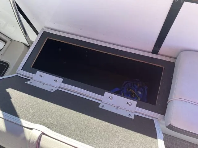 Slide: The Image of Open storage compartment in 2022 G3 SL boat interior. - 11