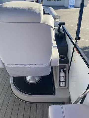 Slide: The Image of 2022 G3 SL boat interior with white seating and fire extinguisher. - 12