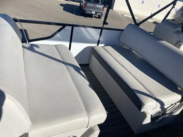 Slide: The Image of 2022 G3 SL boat interior with white cushioned seating and metal railings. - 13