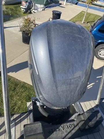 Slide: The Image of 2022 G3 SL outboard motor on a docked boat. - 5