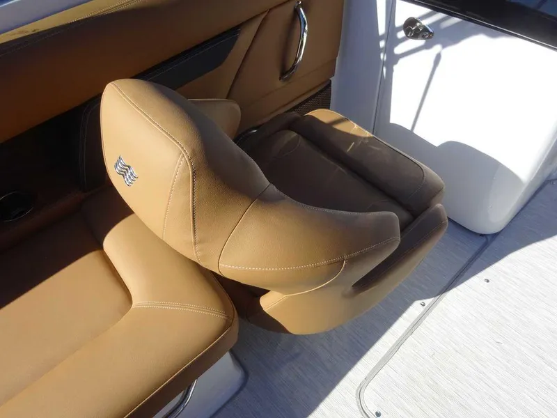 Slide: The Image of 2025 Four Winns HD 5 Sterndrive boat seat, tan leather, luxurious design. - 10