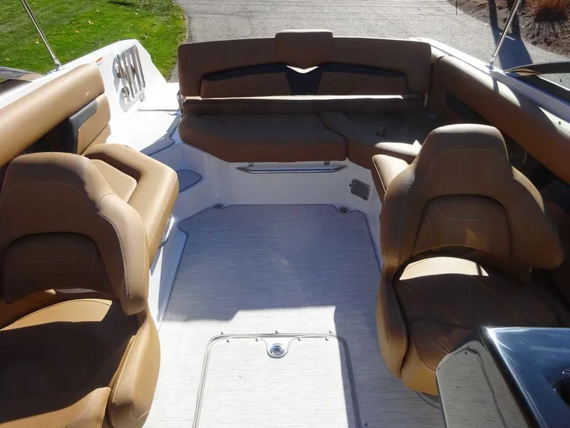 Slide: The Image of Interior of 2025 Four Winns HD 5 Sterndrive boat with tan seating. - 19