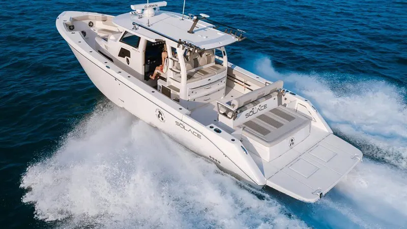 Slide: The Image of 2022 Solace 415 boat cruising on open water, showcasing sleek design and powerful performance. - 1
