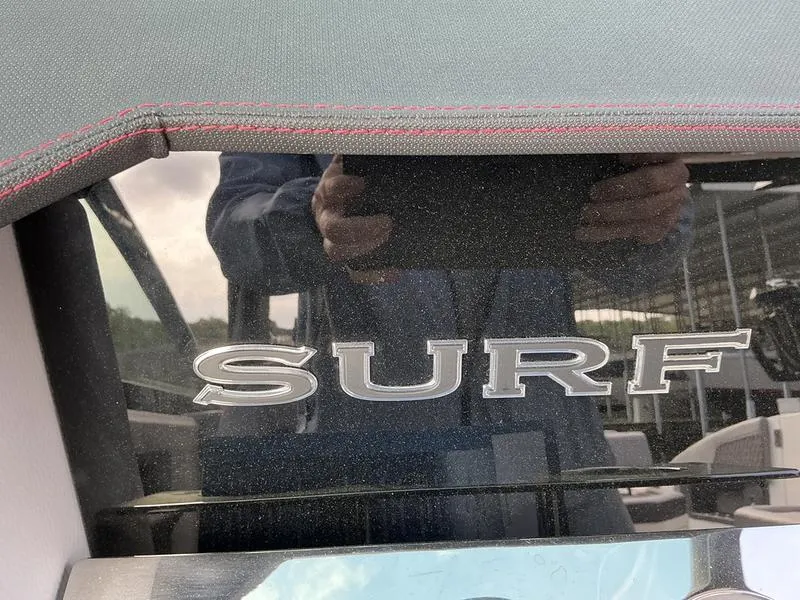 Slide: The Image of Interior of 2025 Cobalt R33 Surf boat with sleek seating and modern design. - 12