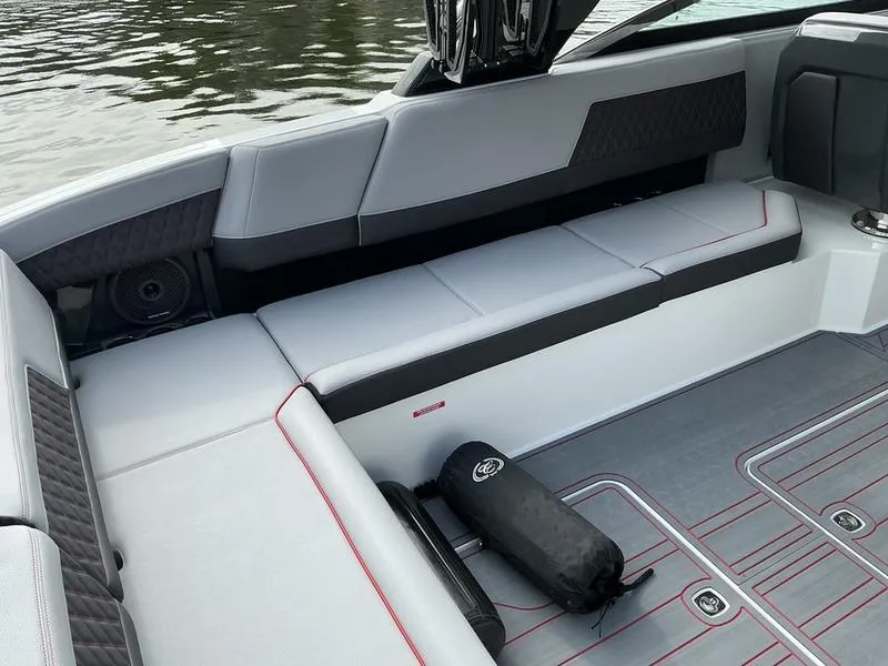 Slide: The Image of 2025 Cobalt R33 Surf boat interior bathroom with modern design and compact toilet. - 16