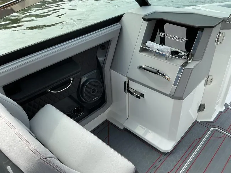 Slide: The Image of 2025 Cobalt R33 Surf dashboard with navigation screens and steering wheel. - 17