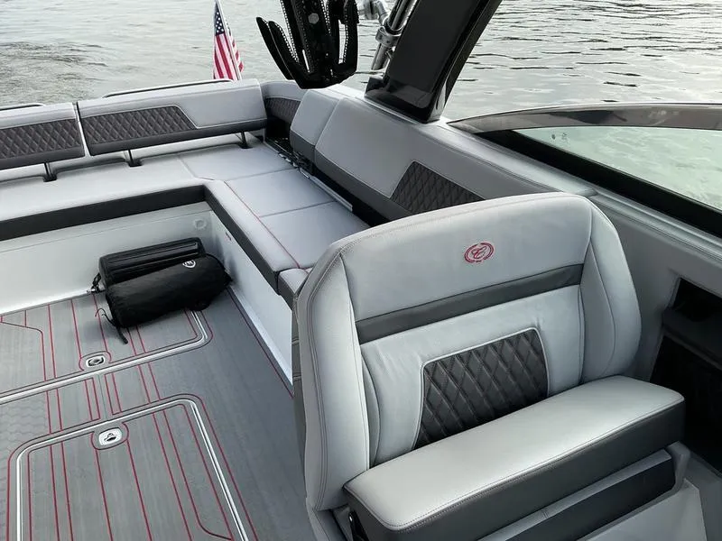Slide: The Image of 2025 Cobalt R33 Surf boat interior with luxurious seating and modern design on the water. - 6