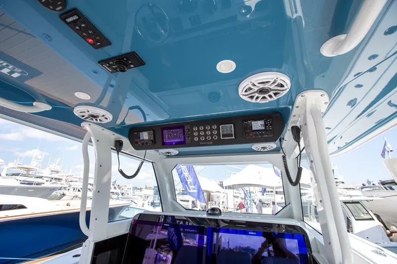 Slide: The Image of Interior view of a 2023 Freeman 47 boat with advanced control panel and speakers. - 10