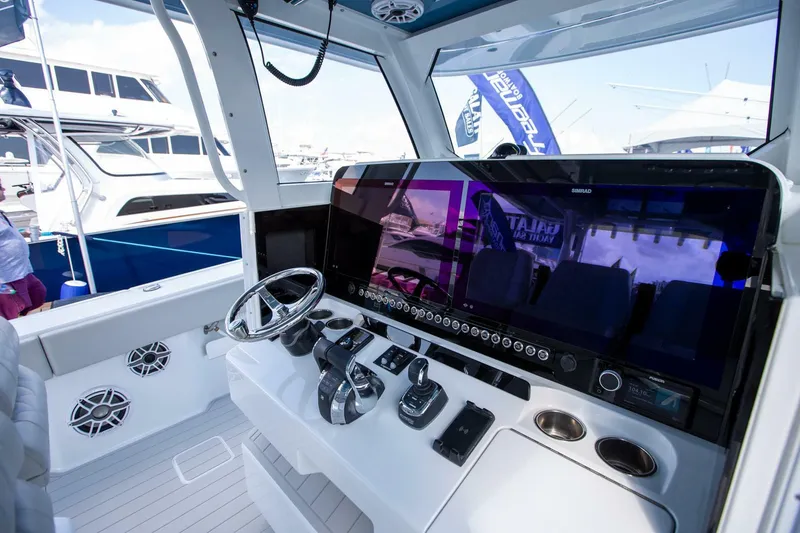 Slide: The Image of Modern Freeman 47 boat cockpit with advanced controls and sleek design, 2023 model. - 15