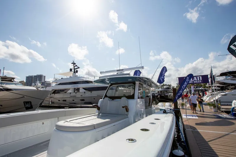 Slide: The Image of 2023 Freeman 47 yacht docked at marina under sunny sky. - 16