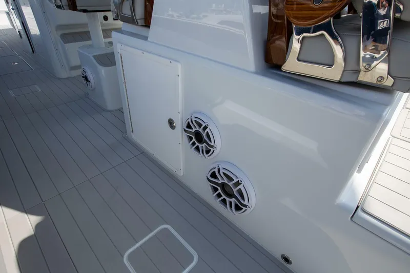 Slide: The Image of Freeman 47 boat deck with speakers, 2023 model, featuring sleek design and modern amenities. - 19