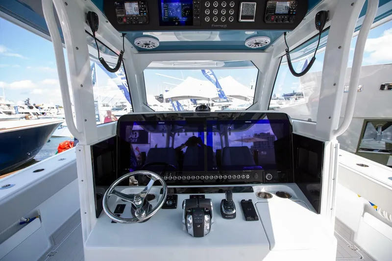 Slide: The Image of 2023 Freeman 47 boat cockpit with advanced navigation controls and steering wheel. - 20