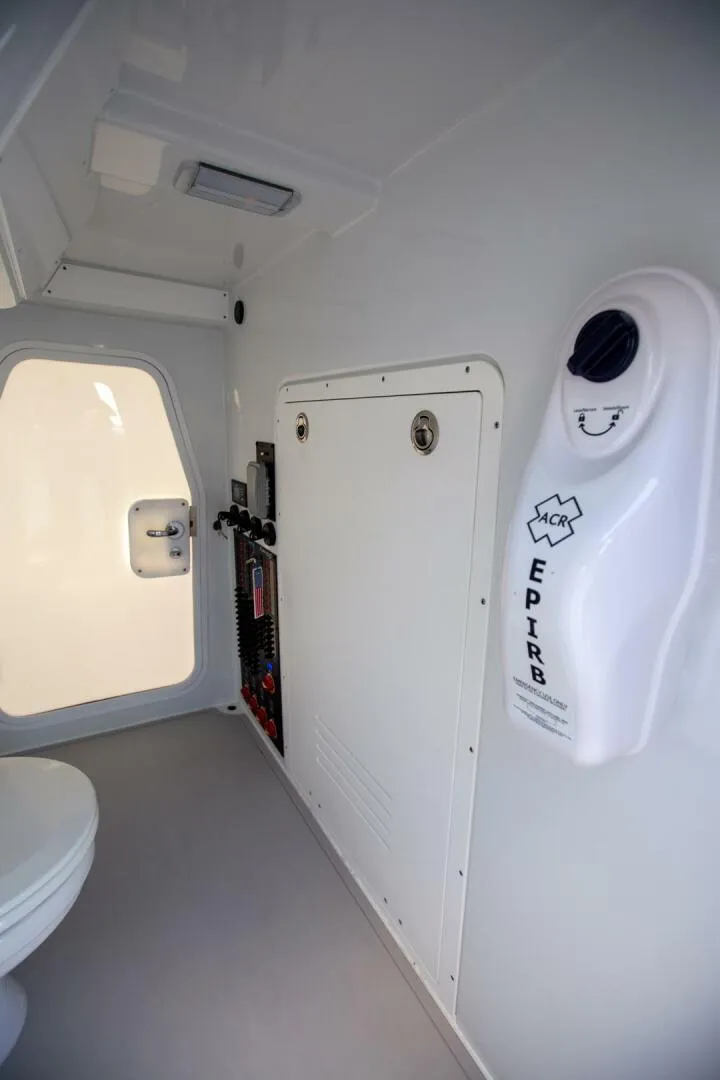 Slide: The Image of Interior of a 2023 Freeman 47 boat featuring EPIRB and safety equipment. - 24