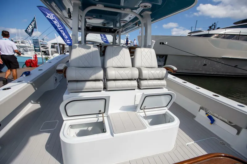 Slide: The Image of 2023 Freeman 47 boat interior with luxury seating and storage compartments. - 25