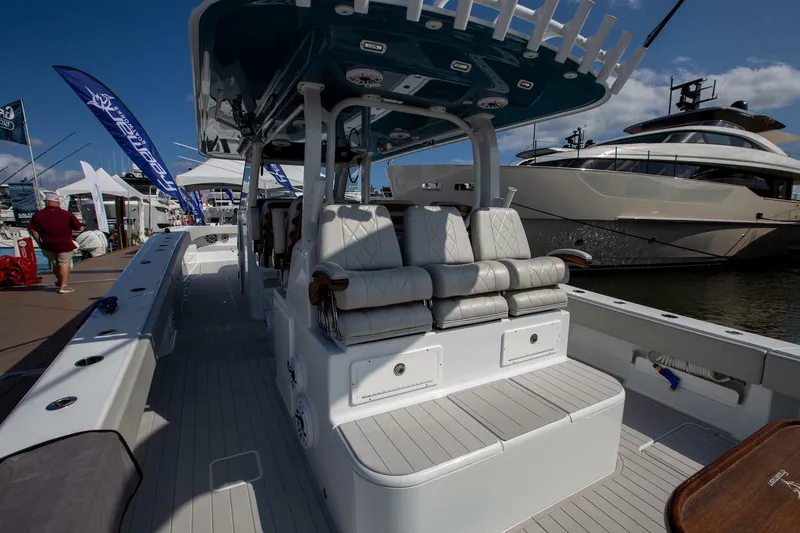 Slide: The Image of 2023 Freeman 47 boat interior with seating, docked at marina. - 6