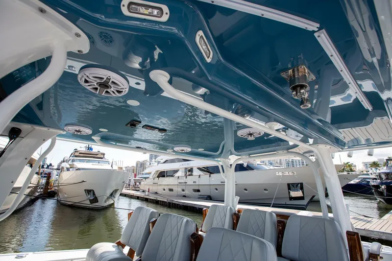 Slide: The Image of Interior view of a 2023 Freeman 47 boat with luxurious seating and sleek design. - 8