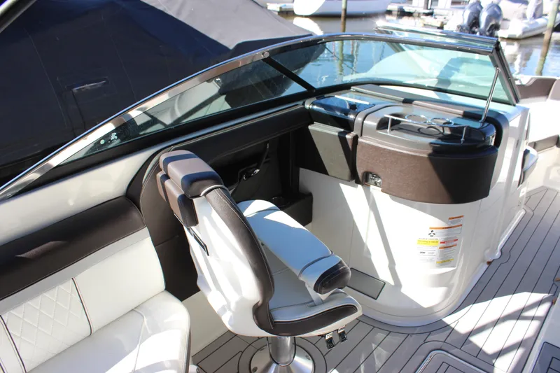 Slide: The Image of 2016 Sea Ray 250 SLX boat interior with sleek seating and modern dashboard. - 11