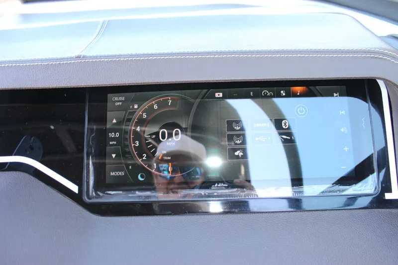 Slide: The Image of Dashboard display of a 2016 Sea Ray 250 SLX boat, showing speedometer and controls. - 14