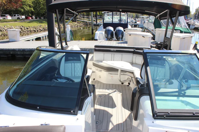 Slide: The Image of 2016 Sea Ray 250 SLX boat interior with open deck and seating. - 18