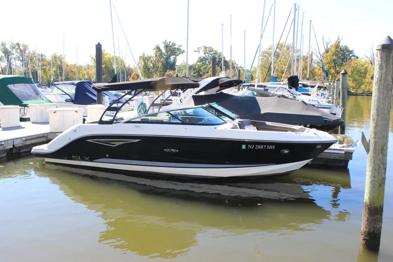 Slide: The Image of 2016 Sea Ray 250 SLX boat docked at marina. - 2