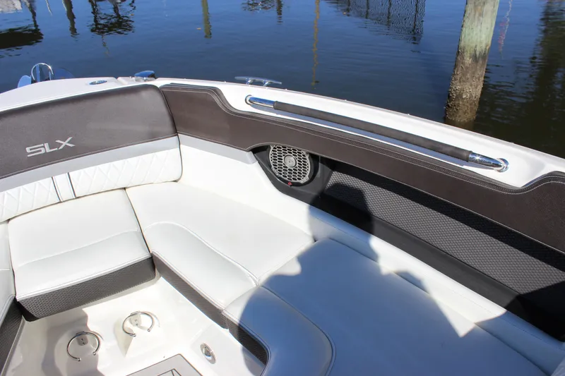 Slide: The Image of 2016 Sea Ray 250 SLX boat interior with white seating and speaker. - 20