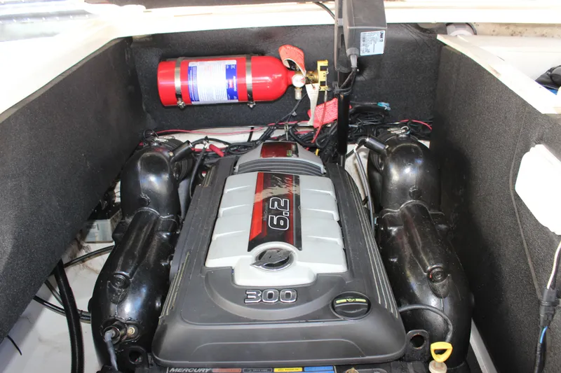 Slide: The Image of Engine compartment of 2016 Sea Ray 250 SLX with fire extinguisher. - 25
