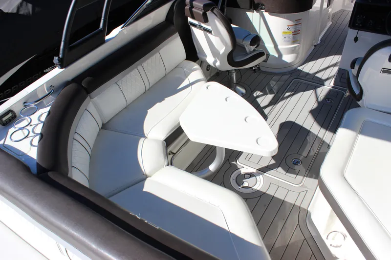 Slide: The Image of 2016 Sea Ray 250 SLX boat interior with white seating and sleek design. - 9