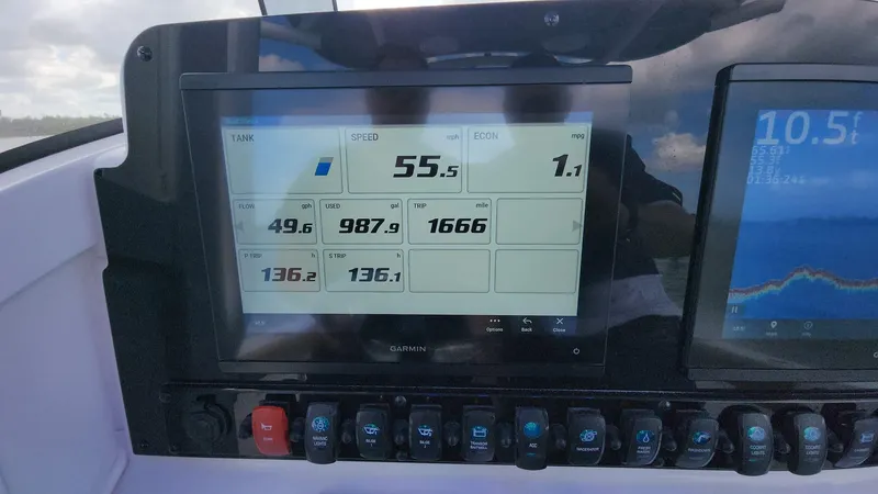 Slide: The Image of Dashboard of 2024 Sea Hunt Ultra 275 SE boat displaying speed and engine data. - 27
